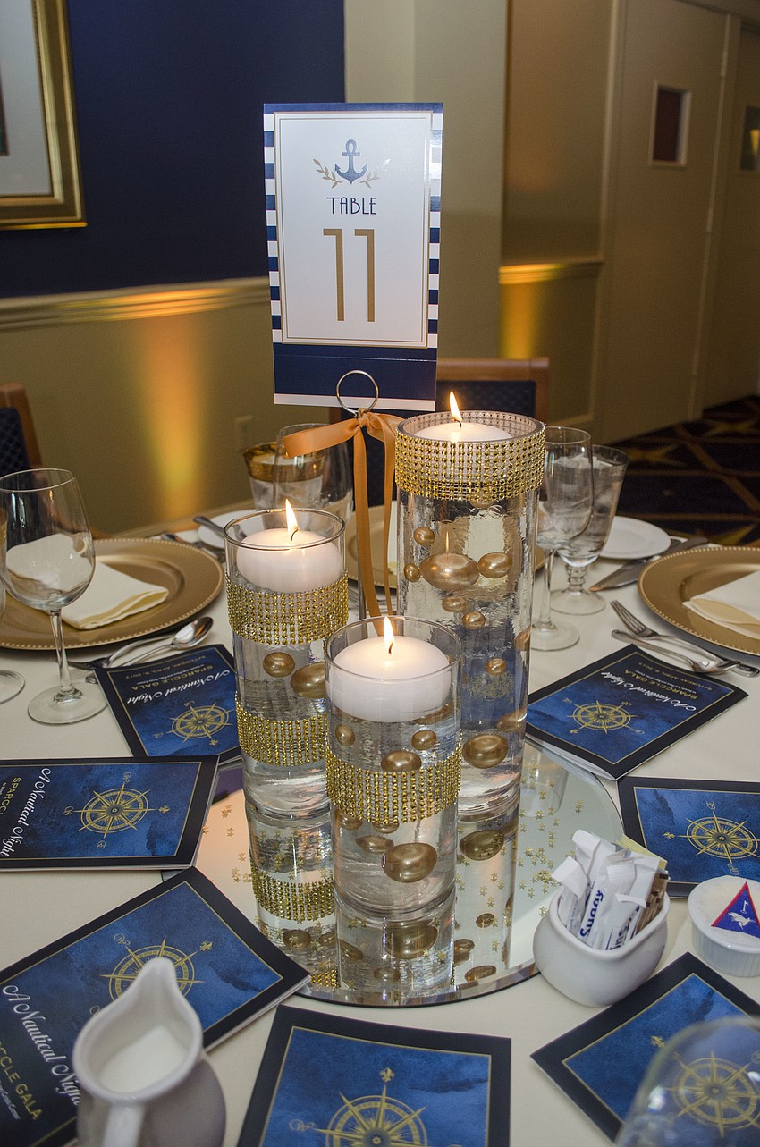 The tables featured gold sparkling decor at SPARCCle Gala: “A Nautical Night” on April 8 at Bird Key Yacht Club.