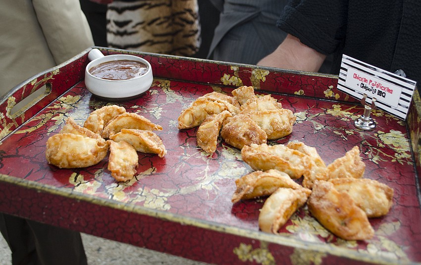 Innovative Dining employees served several hors d’oeuvres such as chipotle BBQ chicken potstickers at Starry Night Dinner 3 on April 17 at the home of Elaine and Bill Crouse.