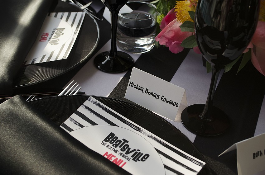 Asolo Repertory Theatre Special Events Manager Laura Stuart Wood designed the table settings with a black and white theme with pops of color at Starry Night Dinner 3 on April 17 at the home of Elaine and Bill Crouse.
