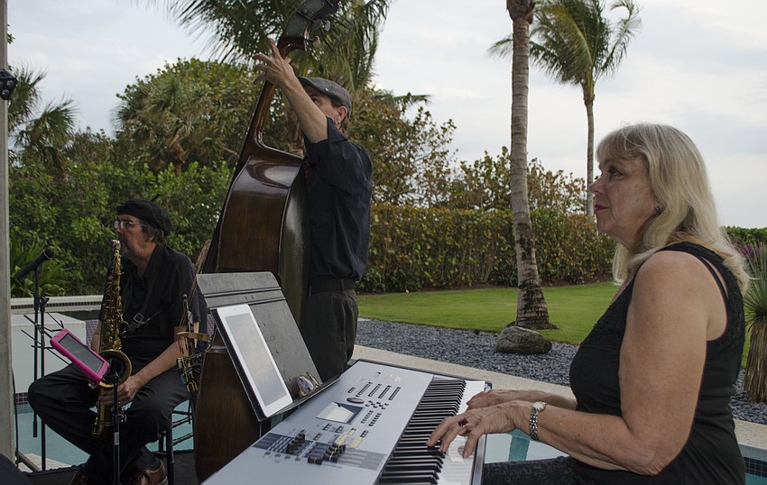 Musicians serenade guests before dinner at Starry Night Dinner 3 on April 17 at the home of Elaine and Bill Crouse.