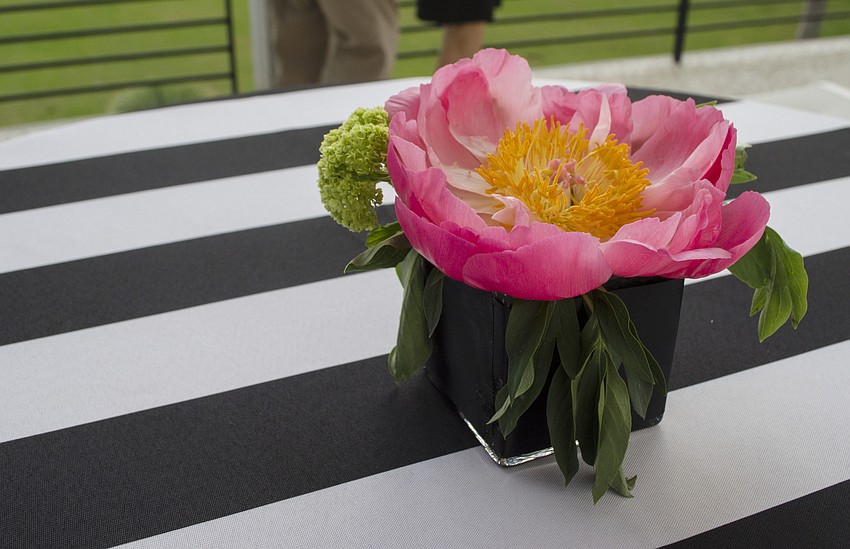 Asolo Repertory Theatre Special Events Manager Laura Stuart Wood designed the table settings with a black and white theme with pops of color at Starry Night Dinner 3 on April 17 at the home of Elaine and Bill Crouse.
