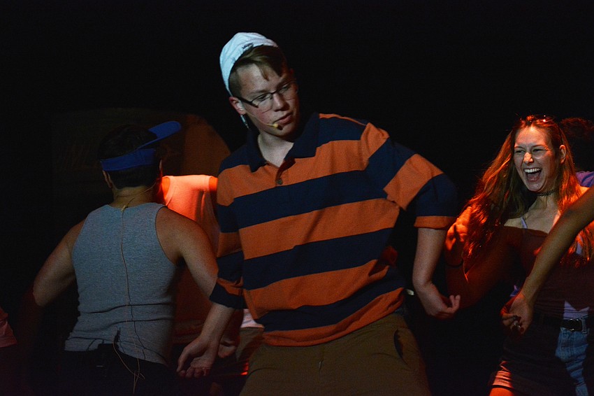 Hayden Ranke, as Grandmaster Chad, leads a song and dance sequence for a fraternity party.
