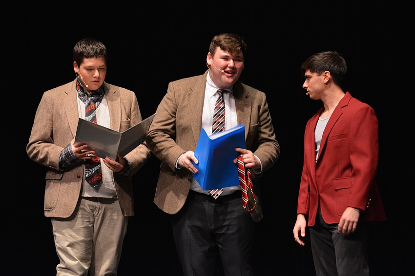 Tyler Moss, Luke Brunner and Anthony Sokolis, as Harvard Admissions officials, question whether a pretty blonde girl has what it takes to become a Harvard law student.