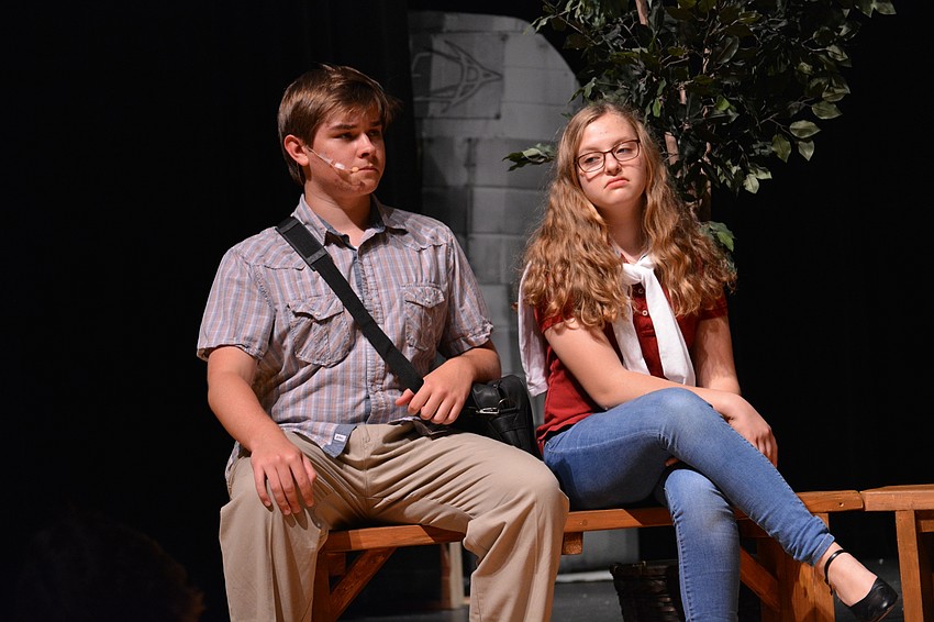 Matthew Martin, as Aaron Schultz, and Kayla Fisher, as Whitney, introduce themselves to Elle and other students in their group on the first day of law school.