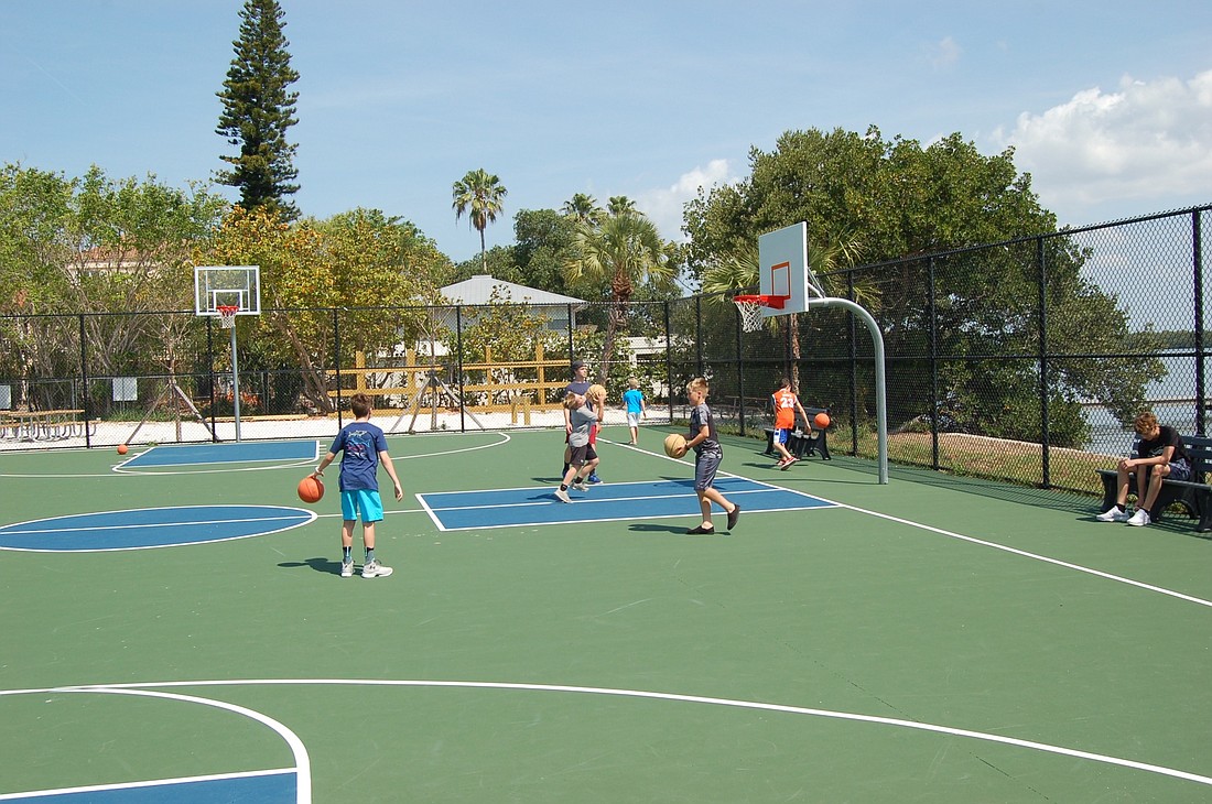 Visiting youngsters play basketball at Bayfront Park.