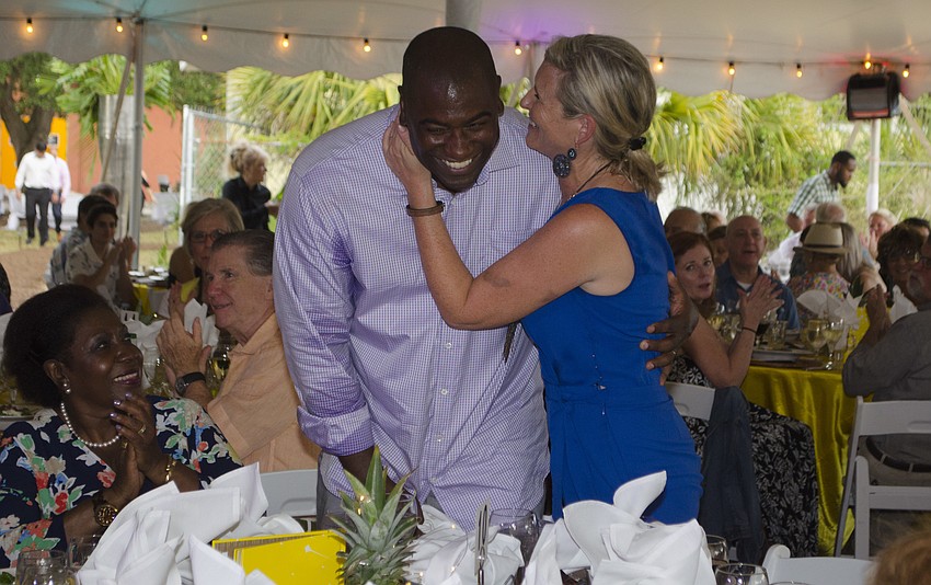 Visible Men Academy Co-Founders Neil Phillips and Shannon Rohrer-Phillips laugh as they’re recognized at Shine On! on April 28 at Visible Men Academy.