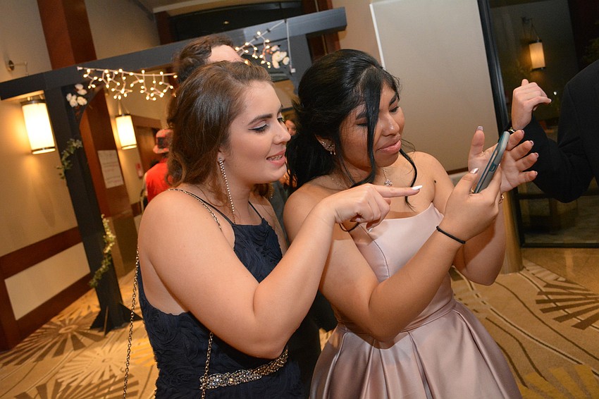 Bayshore High School'   s Ali William and Lakewood'   s Kara Krickl review selfies taken at prom.