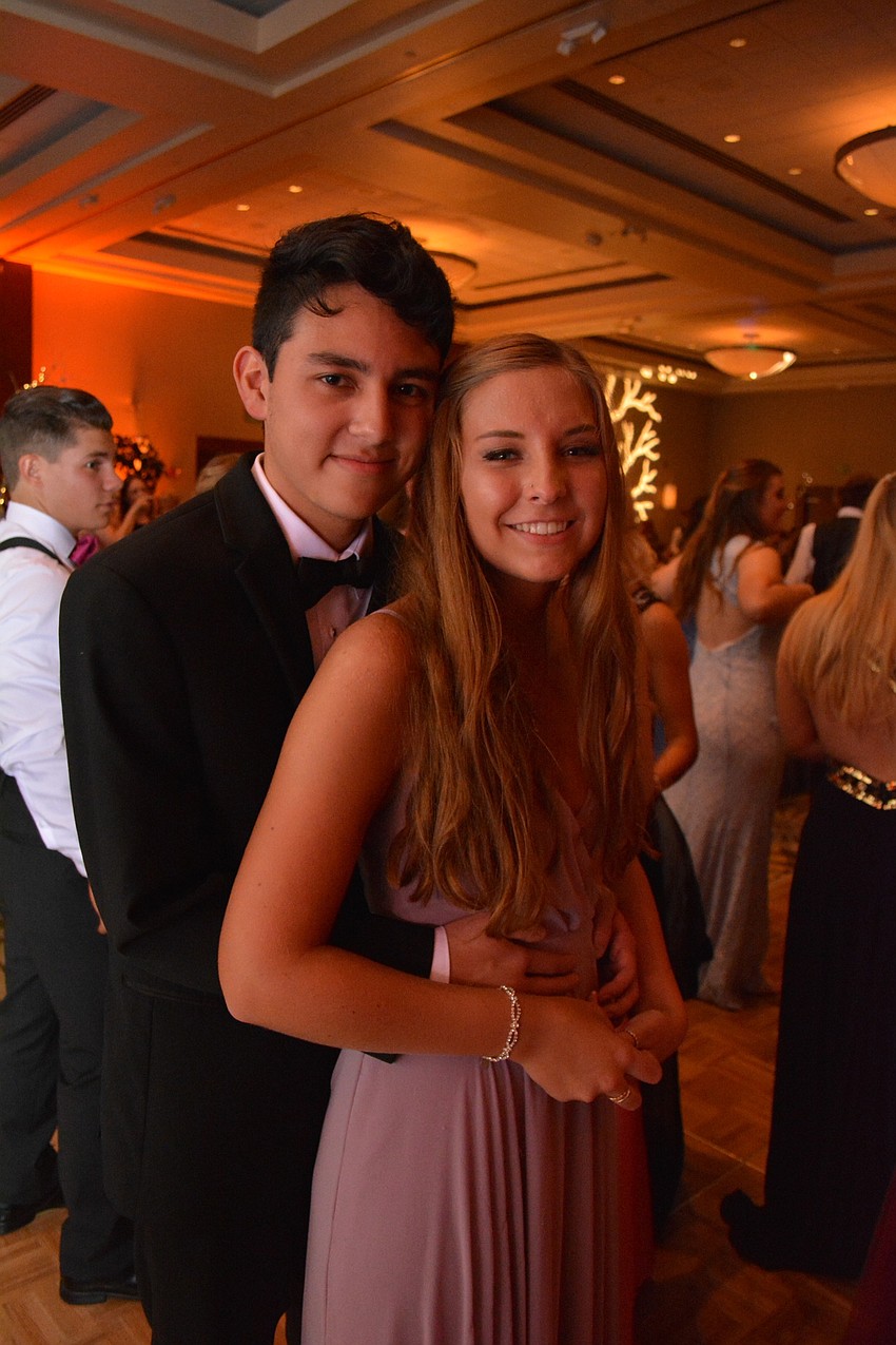 Nic Bustamanto and Katie Holohan hit the dance floor early at Lakewood'   s prom.