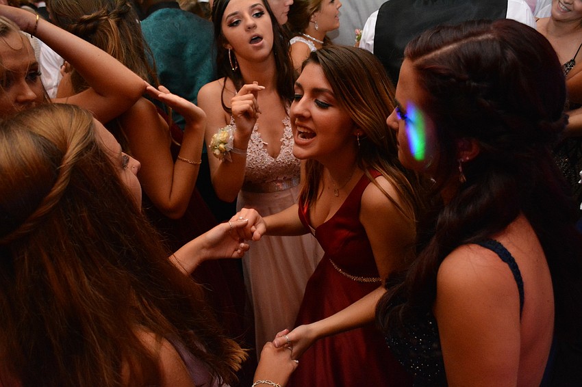 Molly Mendoza, center, dances to 