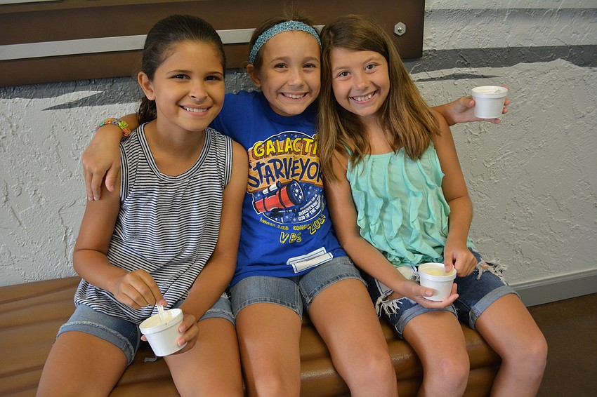 Makenzie Allison, Ysa Reed and Hannah Harper, all of Parrish, enjoy a break for ice cream.