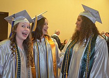 Alyssa Morford, Colby Lindolad and Kailey Carpenter get ready for their speeches at the ceremony.