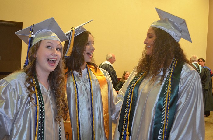 Alyssa Morford, Colby Lindolad and Kailey Carpenter get ready for their speeches at the ceremony.