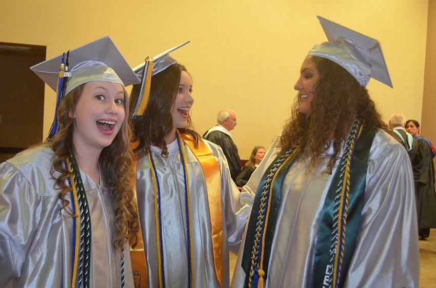 Alyssa Morford, Colby Lindolad and Kailey Carpenter get ready for their speeches at the ceremony.