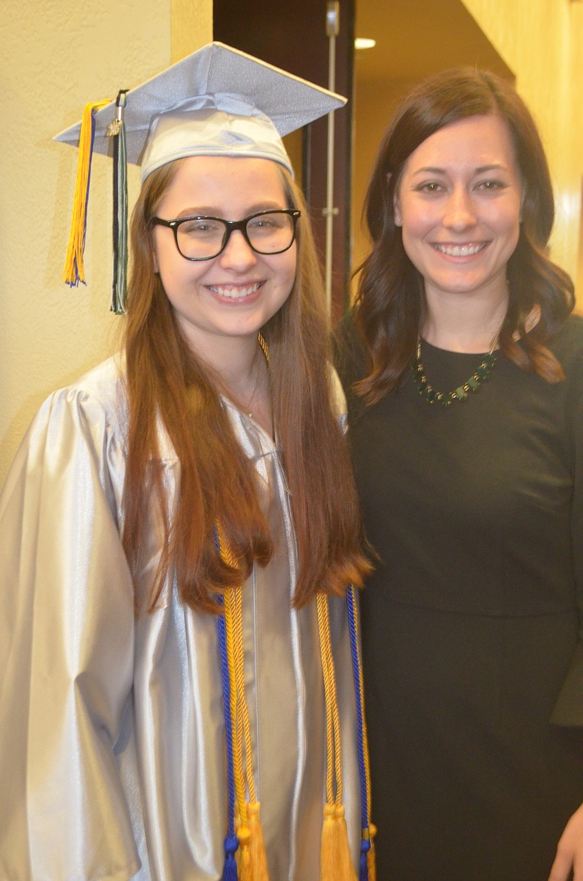 Lauren Parent grabs one of her favorite teachers, Tatum Temple, before she graduates.
