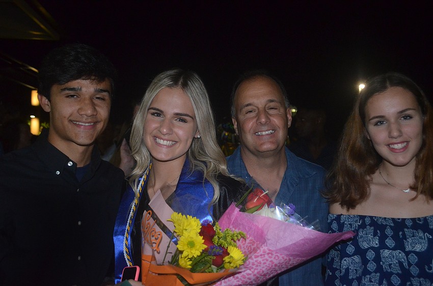 Wilmer Yanez, Daniella Castrogiovanni, Julianna Castrogiovanni and Frank Castrogiovanni celebrate Daniella's graduation with flowers and family time.