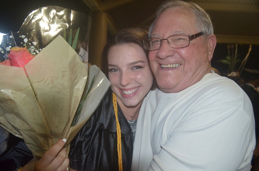 Haley Moreland hugs her grandpa, Marvin Angelton, who said he and the rest of her family are as 