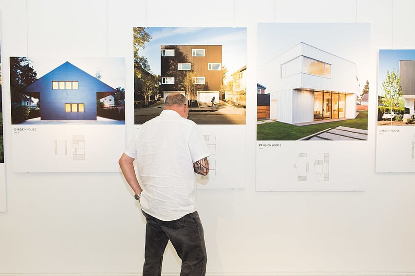 John Pichette views the work on the wall.