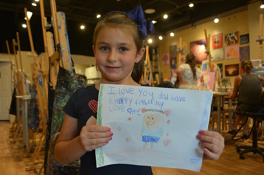 Kate Toscano, a 6-year-old Robert E. Willis Elementary student, says the best thing about her father, Rich Toscano, is that he gives lots of hugs.