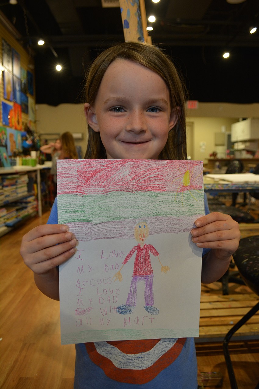 Norah Organek, a 6-year-old Robert E. Willis Elementary student, says the thing she loves most about her dad, Steven Organek, is that he plays a lot of sports.