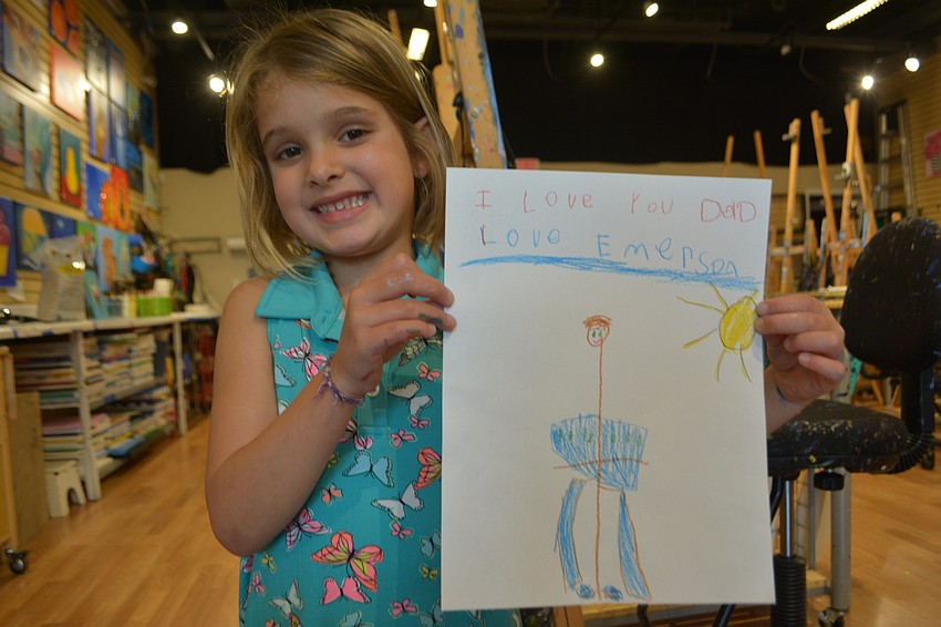 Emerson Trusz, a 6-year-old Freedom Elementary student, says the thing she loves best about her dad, Jared Trusz, is that 