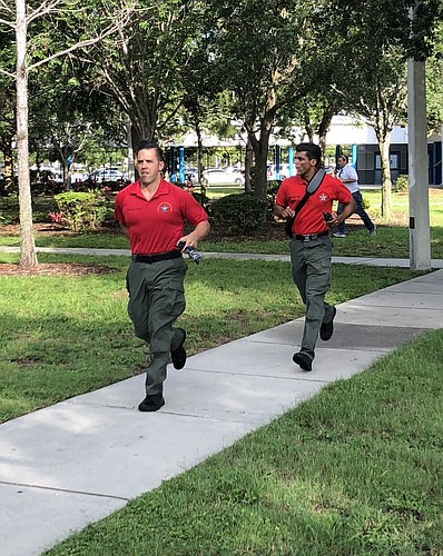 Sheriffâ€™s Office Instructors Sgt. John Finley (left) and Lt. Andy Ramdath oversee the Active Shooter Training. Courtesy photo.