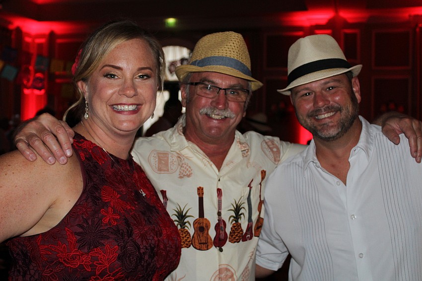 Lakewood Ranch's Erica Mulder, who helped plan the event, enjoys a moment with Randy Bringman and Mark Mulder.