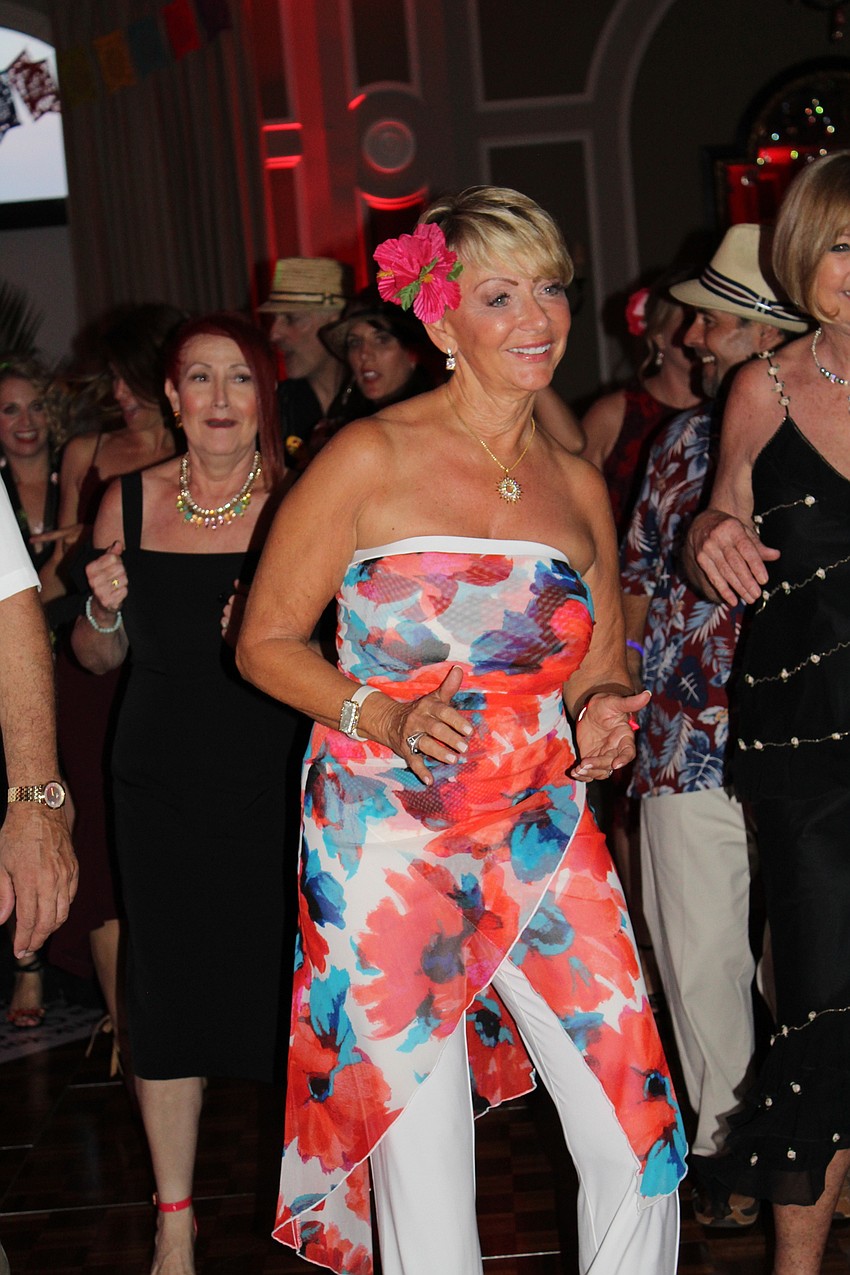 Lakewood Ranch's Clare Murphy dances to Merengue music at the event.