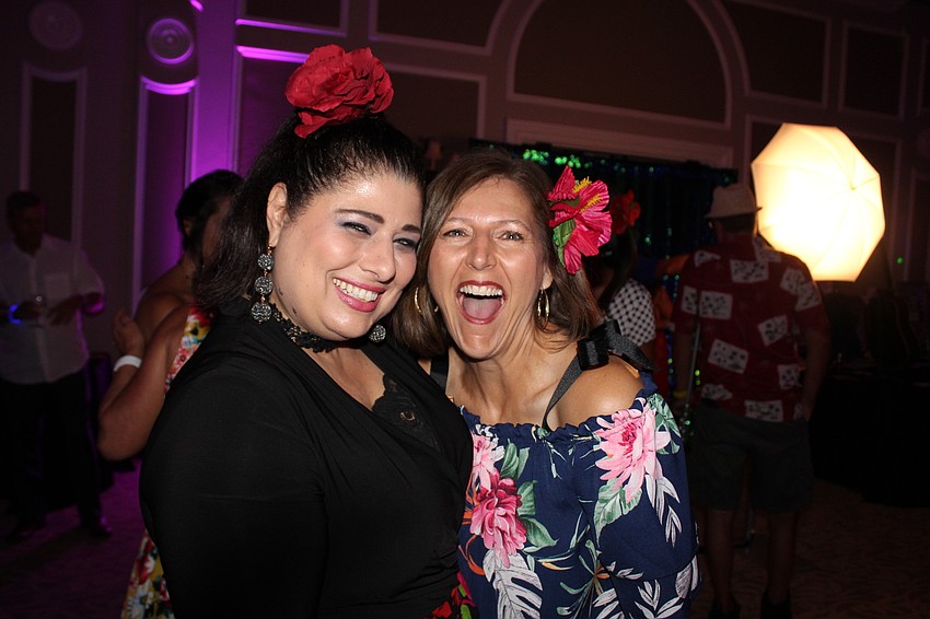 Sarasota's Sally Perron and Bradenton's Christine Fritz enjoy a laugh during the event.