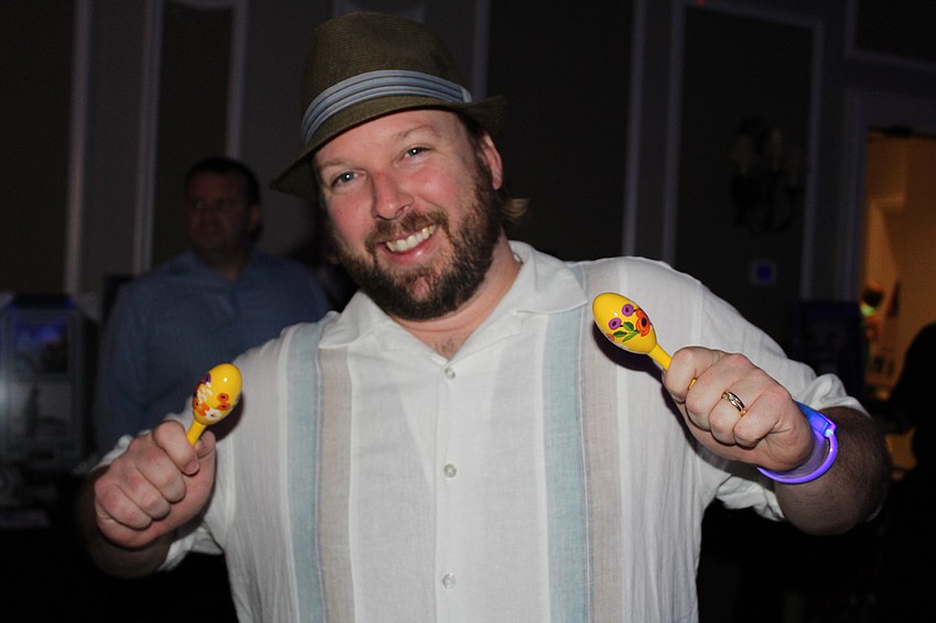 Nokomis' Brian Canty keeps with the theme by shaking some maracas.