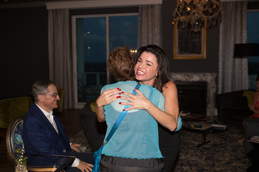 President and CEO Elizabeth Melendez-Fisher hugs Rick and Nancy Moskovitz, recent donors of $1 million to Selah Freedom.