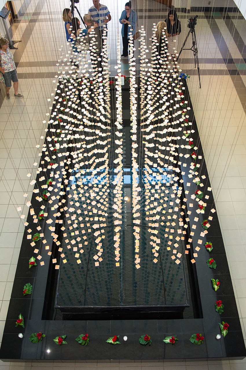 Dozens of roses lined Sarasota City Hall's fountain in honor of the lives lost during the Pulse nightclub attack in Orlando.