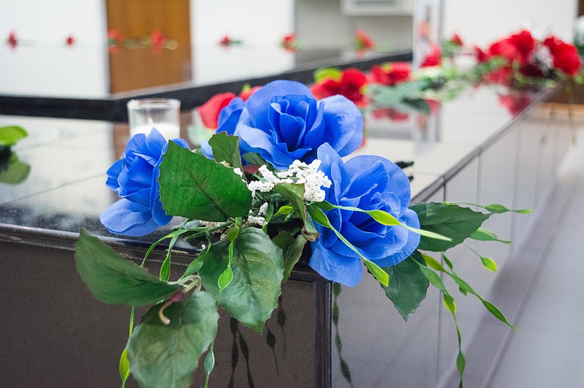 A blue bouquet represents hope and healing for families of the victims.