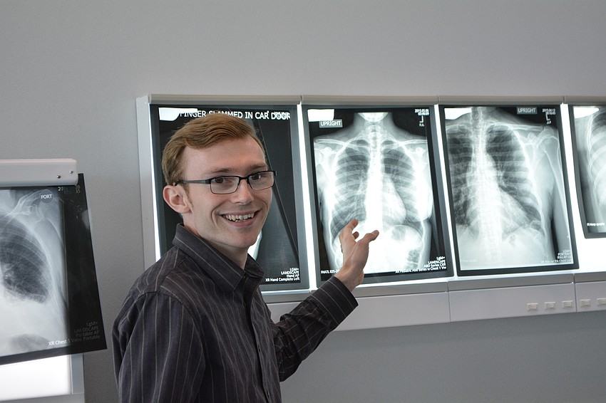 LECOM second-year student Jarrod Mullen questions campers about what they see in X-rays.