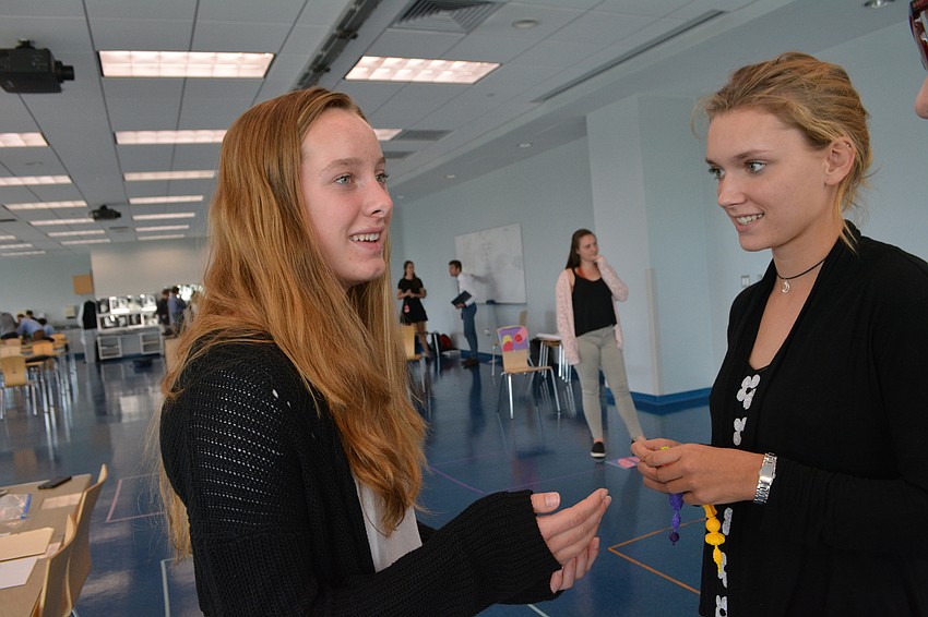Riverview High School's Hailey Manitz, 15, and Ruskin resident Kaitlyn Carruba, 16,  compete in a trivia race about the kidneys and their function.