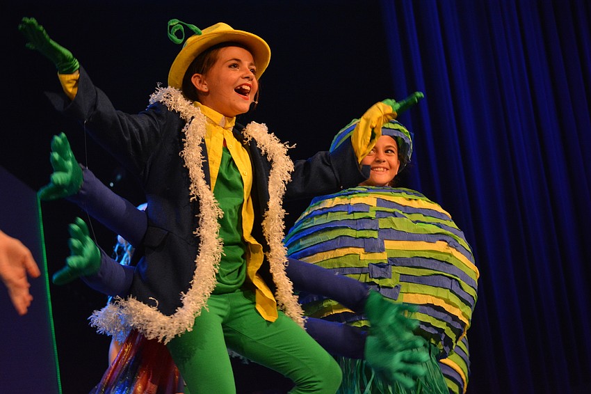 Caterpillar, played by Addison Kolbe, tells Alice about the word 