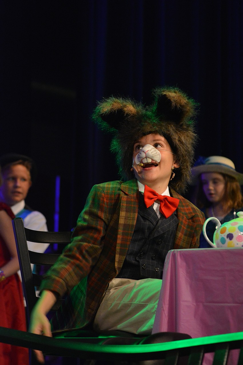 Fredrico Hradek, as March Hare, has some tea during an unbirthday celebration.