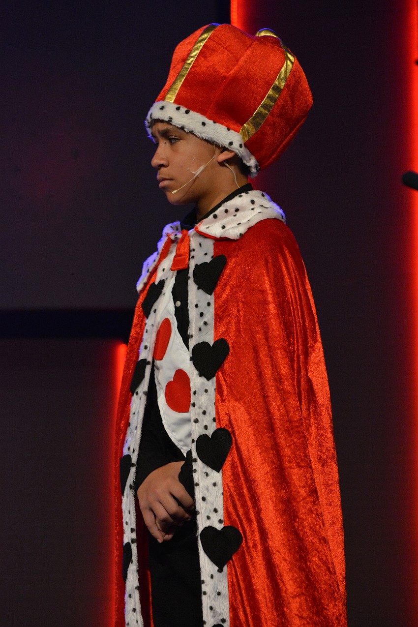 King of Hearts (Jacob Mazzone) asks the queen to have a hearing for Alice, instead of just beheading her.