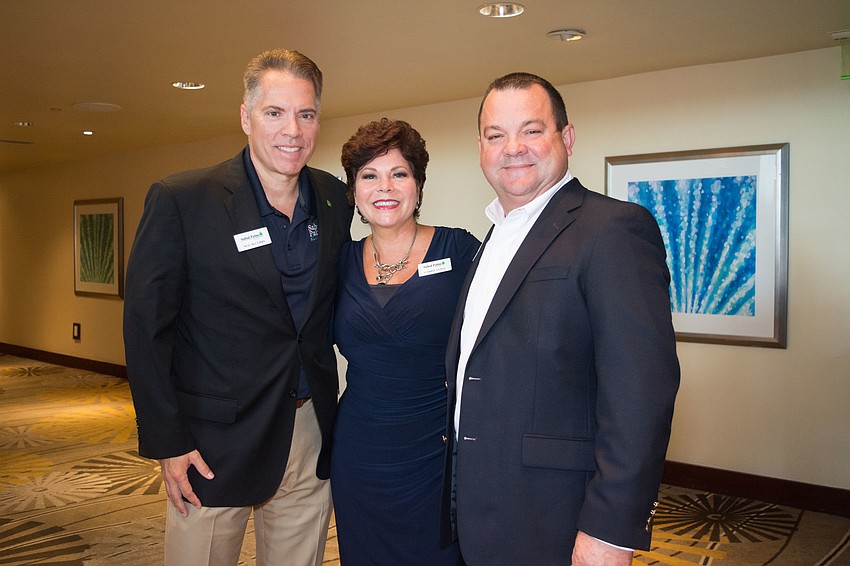 Neil McCurry, Carrie Lewis and Gary Houseworth of Sabal Palm Bank