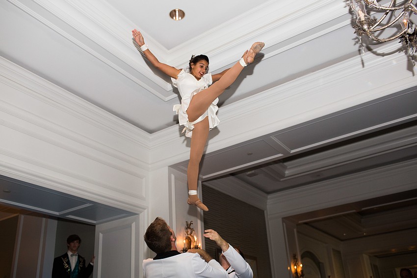 Emma Clarke is thrown into the air by Kevin Moore and Jake Peterman.