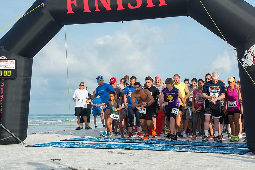 Runners begin the race.