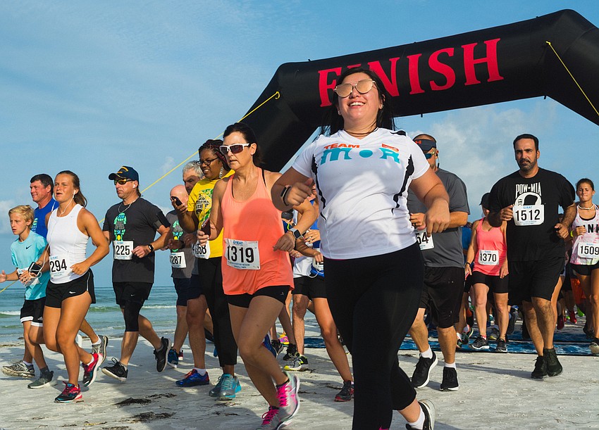 Participants ran with their dads and families or cheered them on from the sidelines.
