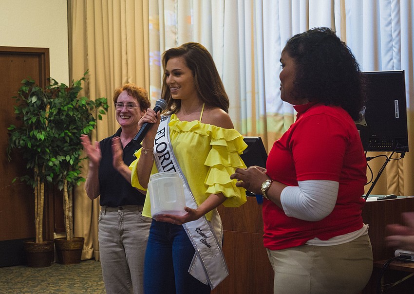 Miss Teen Florida United States Noelia Voigt makes a surprise appearance to give away raffle tickets.