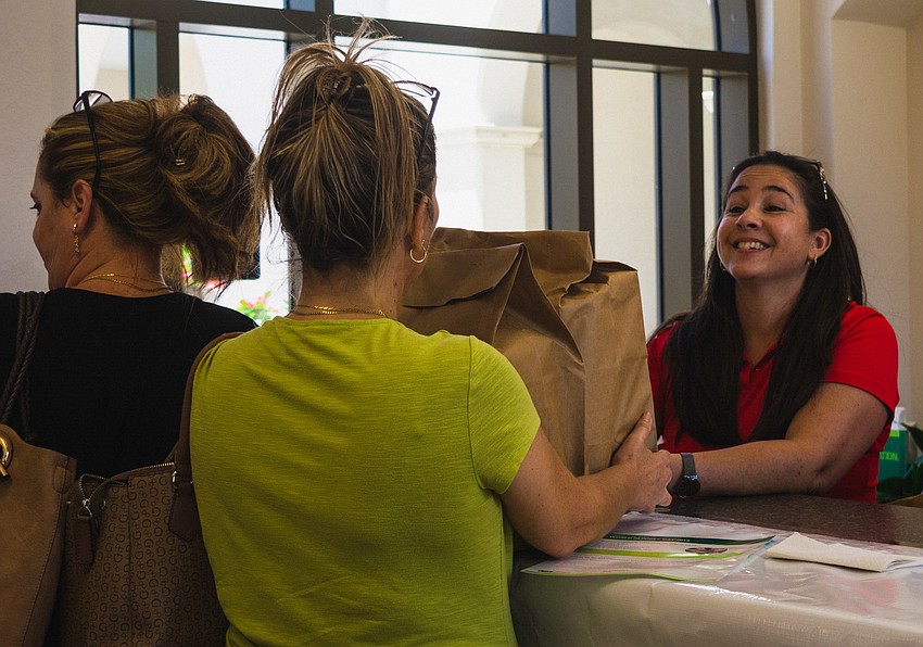 Tamara Fernandez helps give out supplies to refugee families.