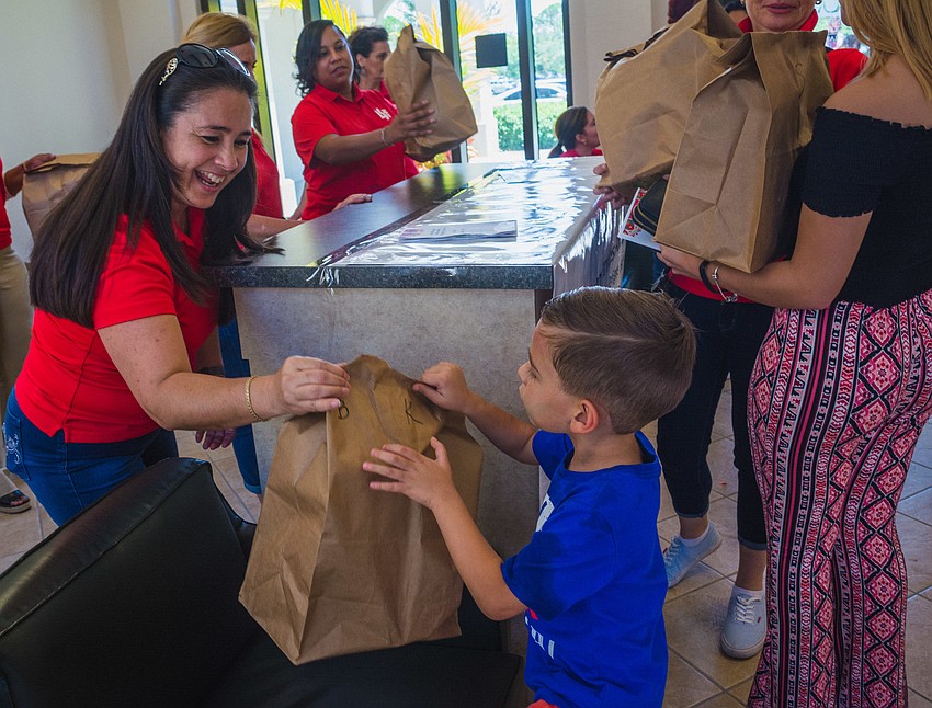 Tamara Fernandez helps give out supplies to refugee families.