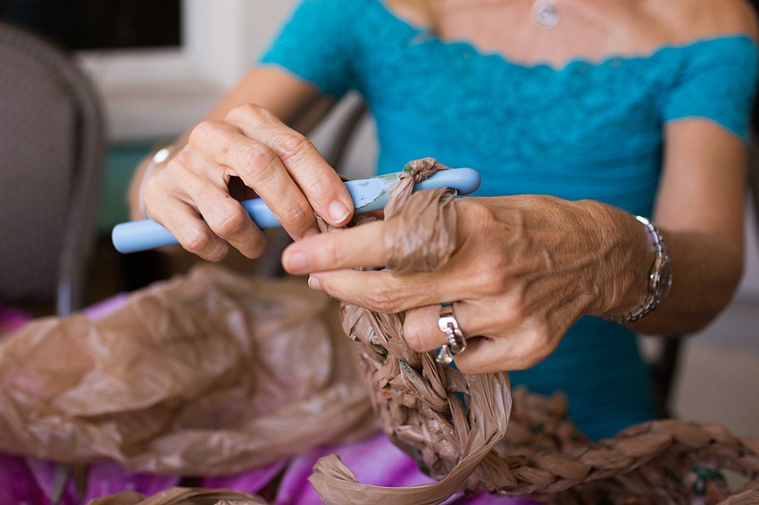 Once she has all the plarn, it takes about eight hours to crochet a mat.