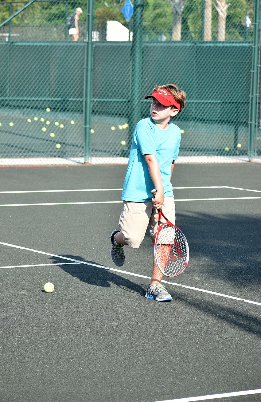 Silas Rizzi watches the ball he hit sail over the net.