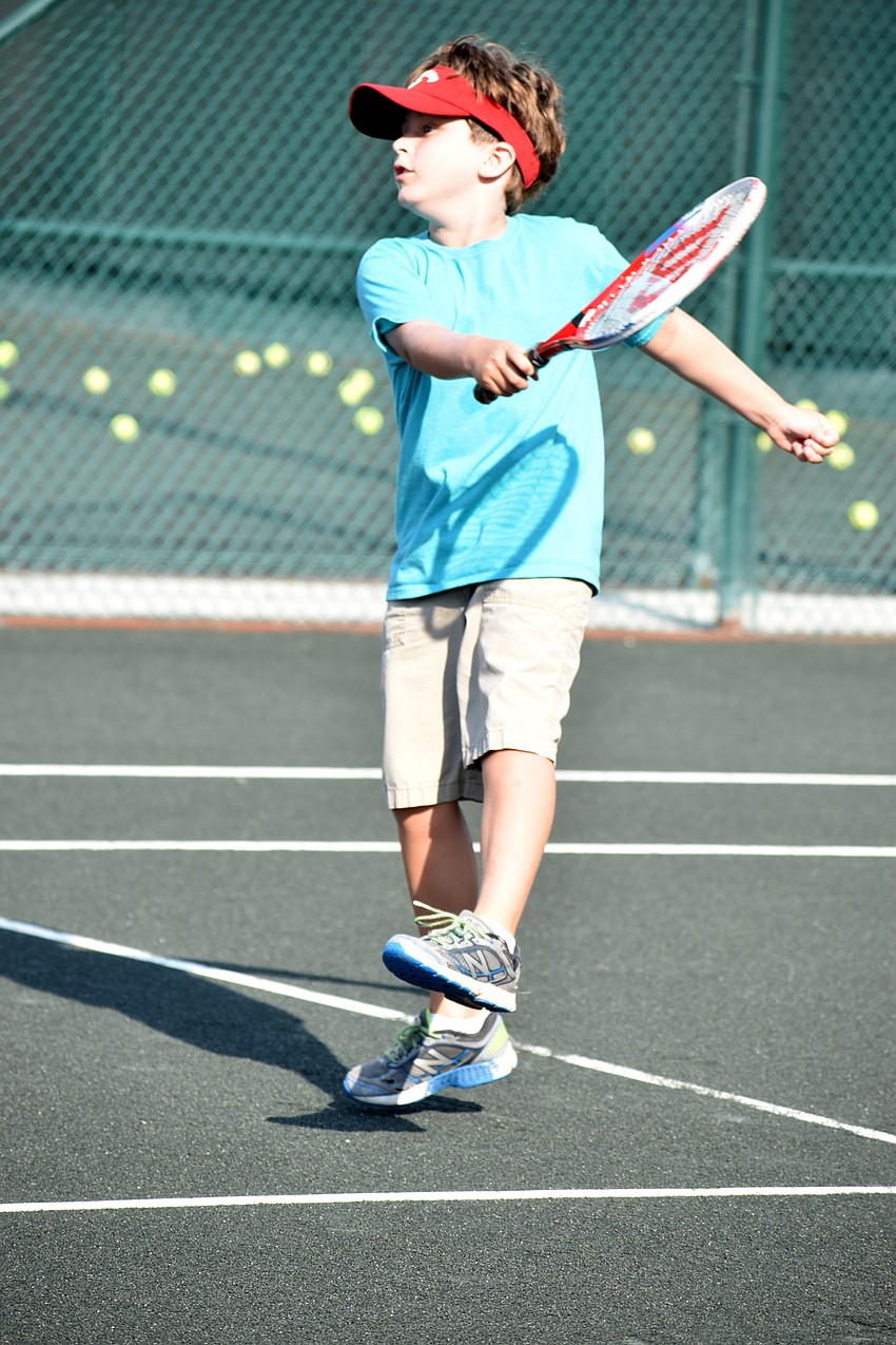 Silas Rizzi hits the ball over the net during a drill.