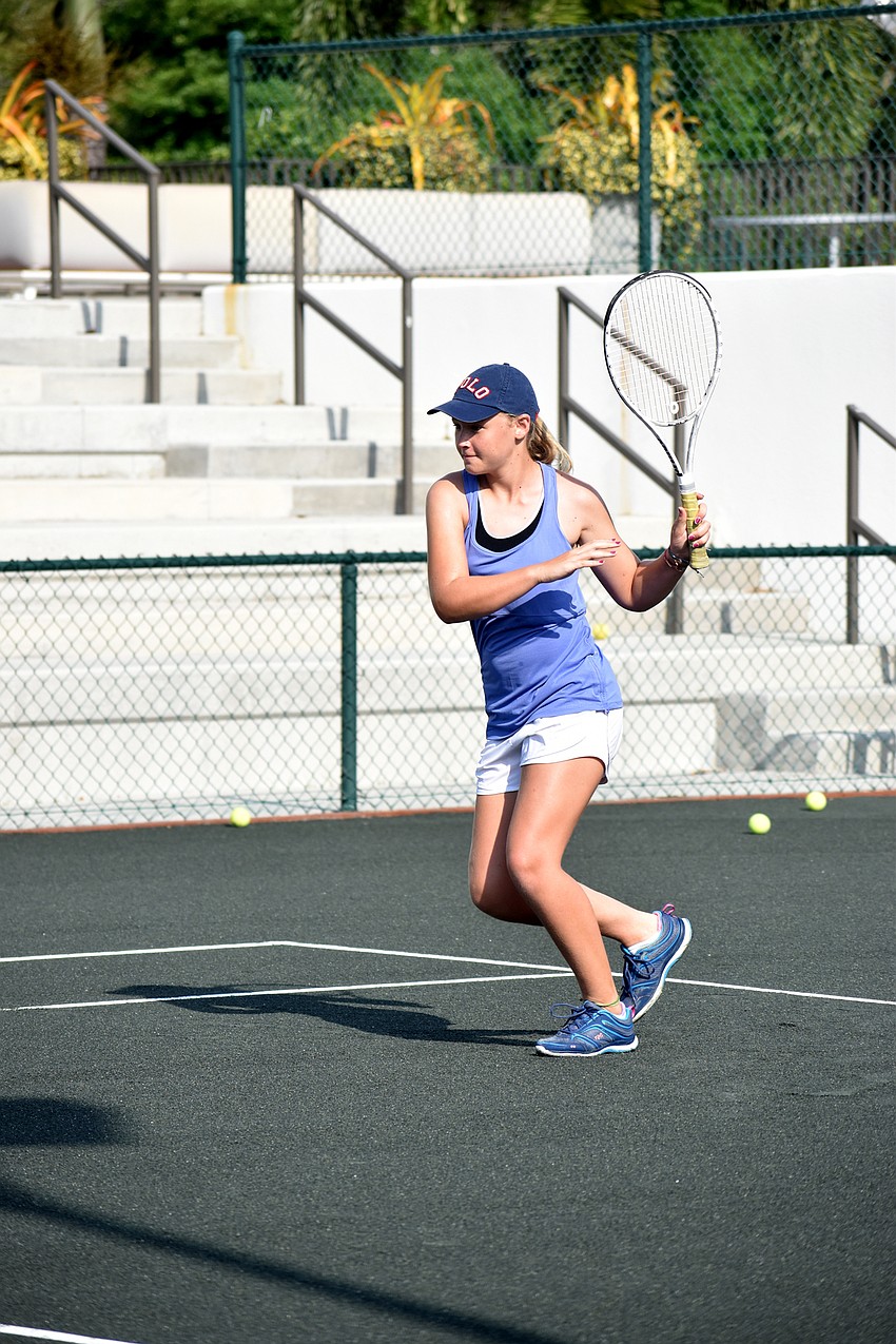 Regan Walter returns the ball over the net.