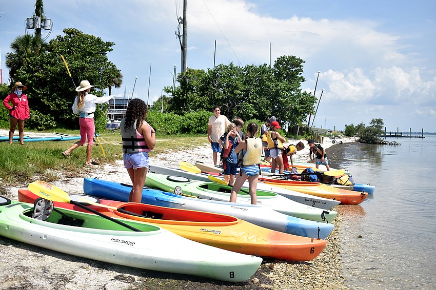 After a stand-up paddleboard trip, campers jumped in kayaks and explored Sarasota Bay.