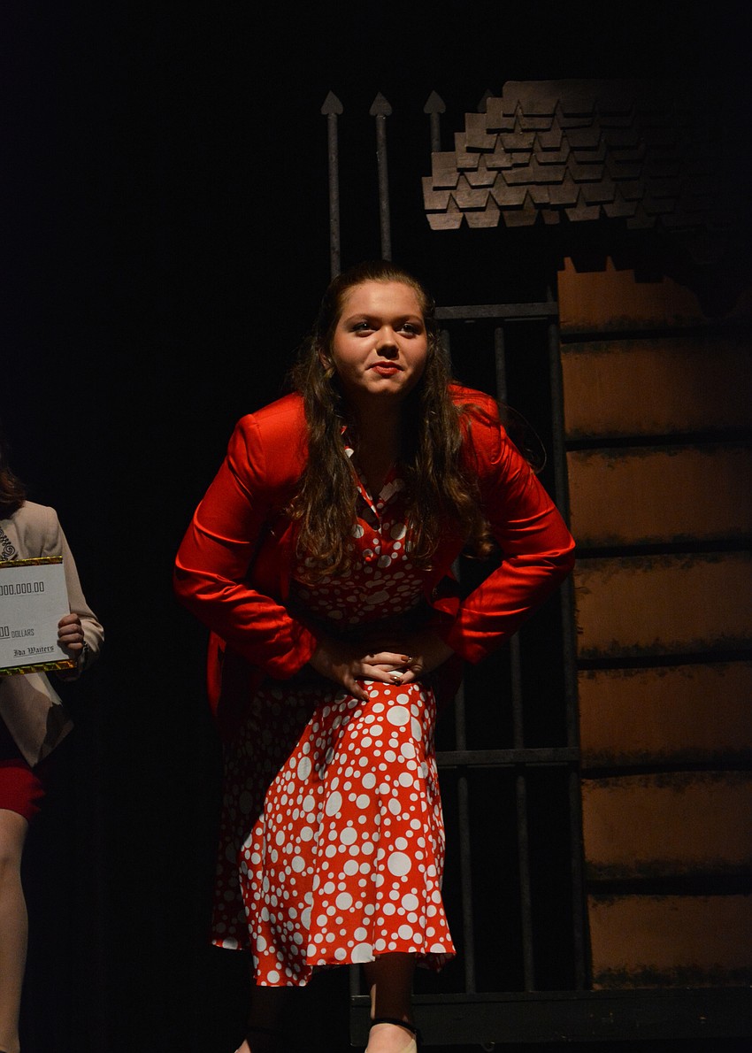 Counselor Jordan Bollinger acts as a reporter out for an exclusive on the giant peach.